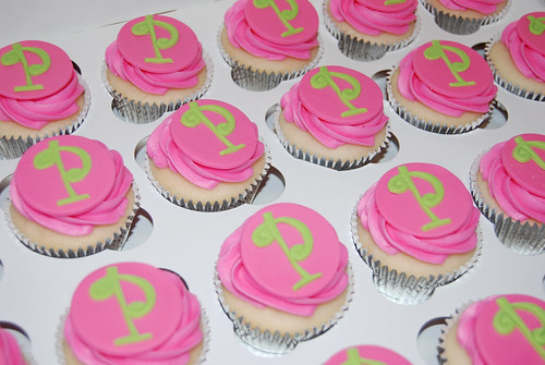 pink and green monogram cupcakes for a 50th birthday celebration