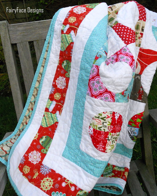 Christmas quilt draped on chair