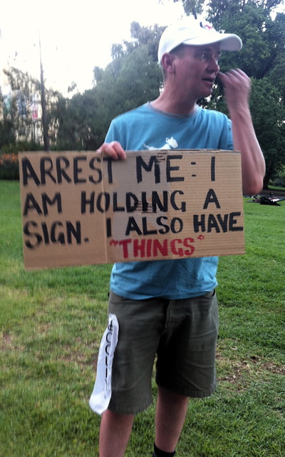 Kev + sign + things: arrest this man