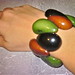 http://www.latinartjewelry.com/tagua-bracelet-black-brown-and-green-big-potato-stly.html