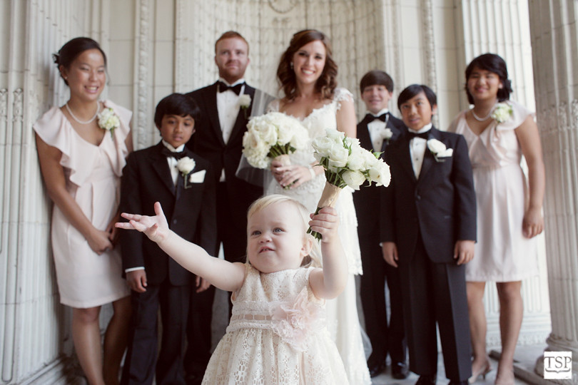 Flower Girl in Front of Bride and Groom