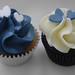 Navy and white mini wedding cupcakes, decorated with two sugar hearts