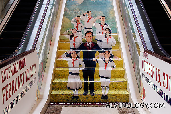 A promotional ad for the musical on the stairs at Maxims Tower