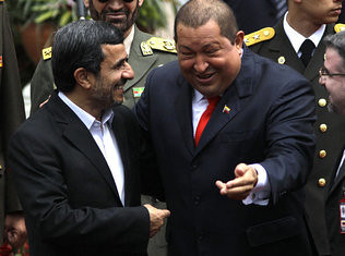 Iranian President Ahmadinejad and Venezuelan President Chavez share a laugh during the Iranian leader's visit in Latin America. US imperialism has attacked both revolutionary leaders. by Pan-African News Wire File Photos