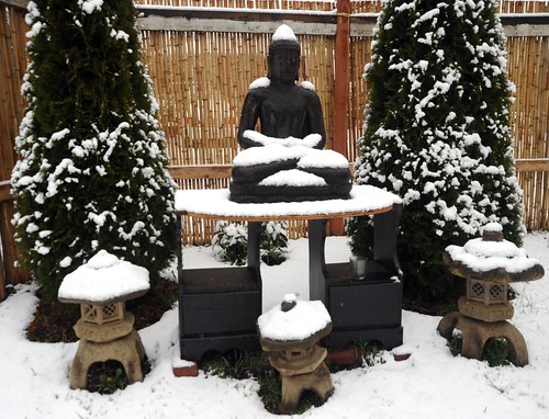Snow Buddha, outdoor shrine, Japanese stone lanterns, trees, bamboo fence, Seattle, Washington, USA by Wonderlane