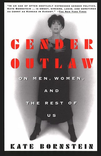 The book cover of Kate Bornstein's "Gender Outlaw: On Men, Women, and the Rest of Us" showing Bornstein standing with folded arms