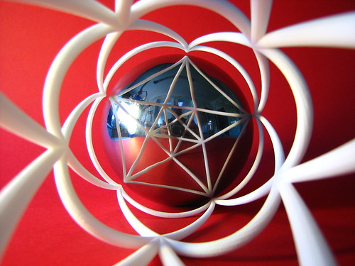 3D anamorphosis with a spherical mirror and a distorted shape put on a cylinder