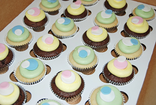 sassy circle cupcakes for a baby shower - spring yellow, green, blue and pink