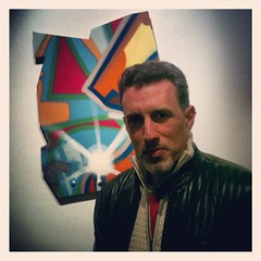 John Matos, aka CRASH, with one of his spray paint on aluminum works for "Remnant Memories"