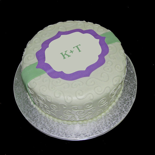 cream and purple bridal shower cake