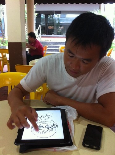 digital live caricature sketching on iPad Sketchbook Pro at a coffee shop