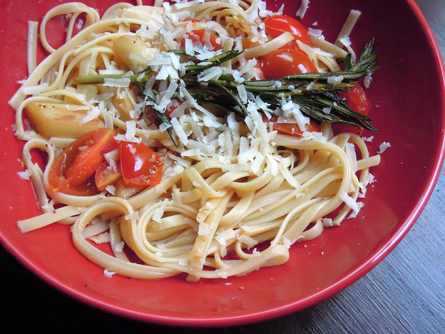 Tagliatelle with white asparagus, cherry tomatoes, rosemary and fresh parmesan
