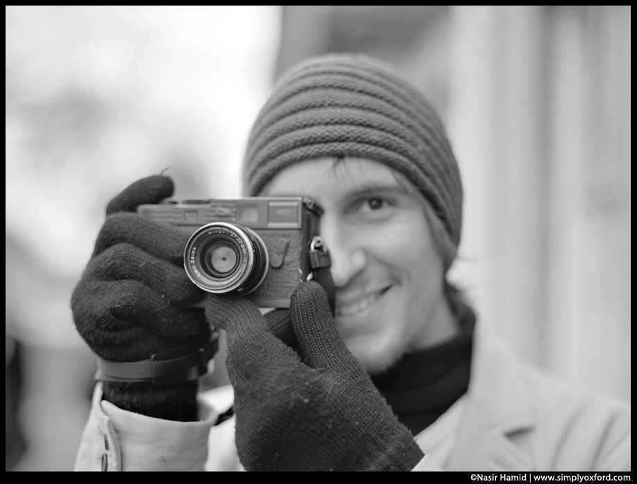photographer holding a leica camera