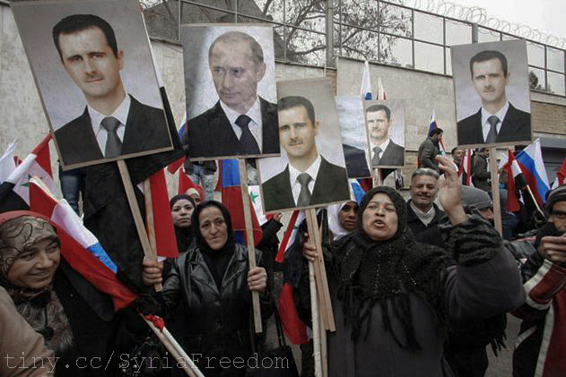 Syrians hold photos of Assad and Putin during a pro-regime protest in front of the Russian embassy in Damascus, Syria, Sunday, March 4, 2012.