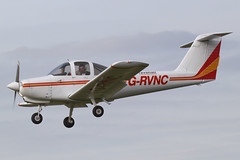 G-RVNC - 1979 build Piper PA-38-112 Tomahawk, pilot waving as he performs a planned go-around at Barton