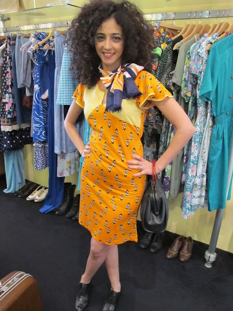 Vintage 1970s printed orange dress and printed silk scarf from Granny's Day Out.