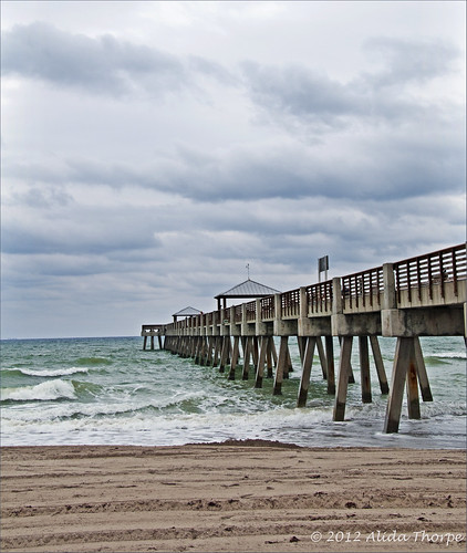 stormy pier by Alida's Photos