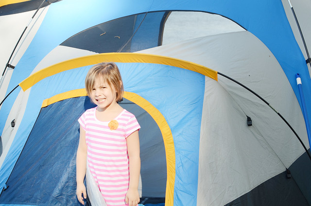 avery in front of tent