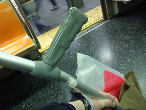 Tired shopping on the subway with the crutch