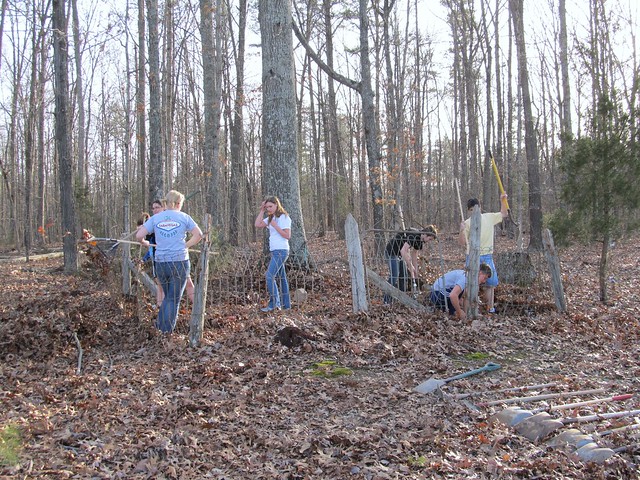 Longwood University Lambda Alpha Anthropology Honor Society students and members of the Primitive Technologies Club clean up the Redd Family plot at Starhope Church.