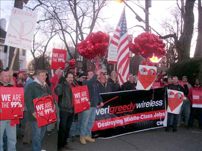 Members of CWA Local 1103 and 1105 gather at a Verizon Board Members house with a Valentine's Day Message.
