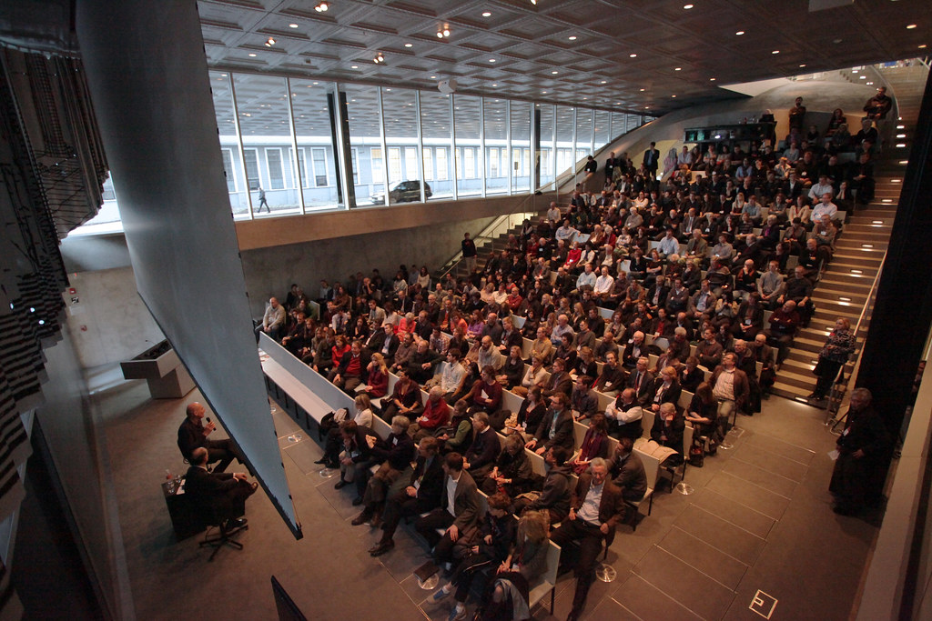 The view from the Abby and Howard Milstein Auditorium balcony showing Dean Kent Kleinman in conversation with Rem Koolhaas.