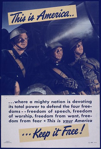 406px-THIS_IS_AMERICA..._WHERE_A_MIGHTY_NATION_IS_DEVOTING_ITS_TOTAL_POWER_TO_DEFEND_THE_FOUR_FREEDOMS._-_NARA_-_515761