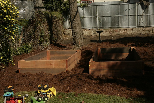 Empty raised beds and toys.