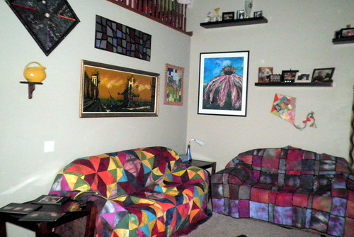 Both of my couches with quilts on them