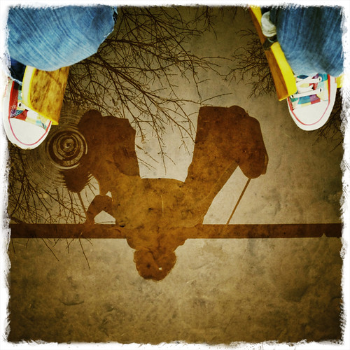 #fromwhereistand - suspended on the swings over a puddle