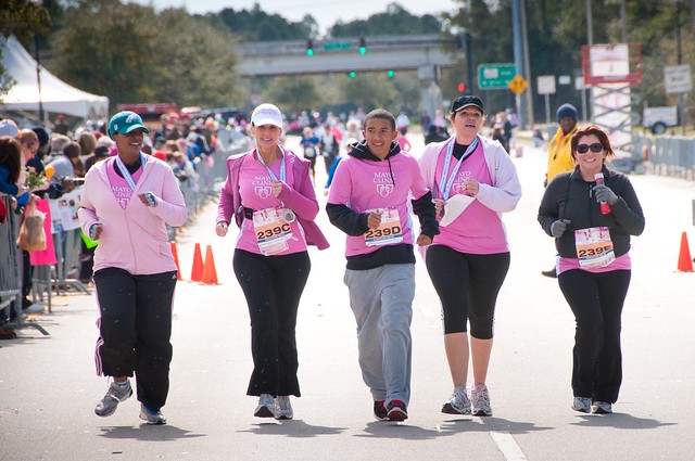 (left to right) Claudette Goode, Margaret Russell, Leel Williams, Karla Phipps and Karol Rojas approach the finish line of the 2012 26.2 with Donna race in Jacksonville, FL.