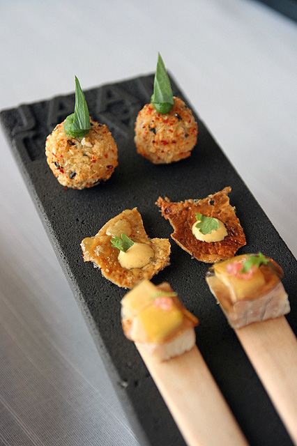 Starter bites - potato croquet, grilled chicken skin, and smoked eel with pickled apples