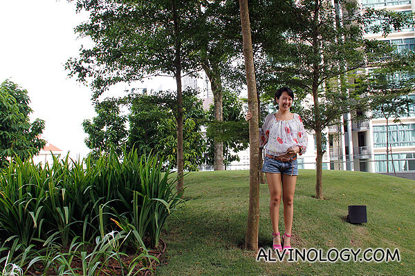 Blogger Christine posing by a tree