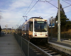 A southbound train pulls into the Flavel Street station