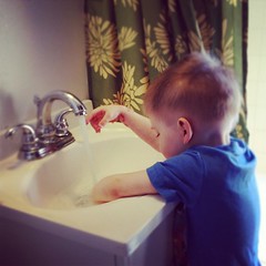 Working on his hand washing skills. #masterquinn #playtime #kids #