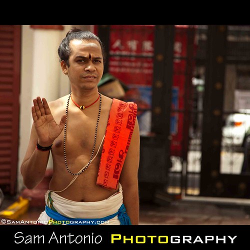 Warding off Photographers in Singapore’s Chinatown by Sam Antonio Photography