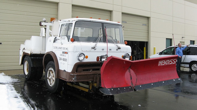 1974 Ford 750 Custom Cab tow truck equipped with a snowplow