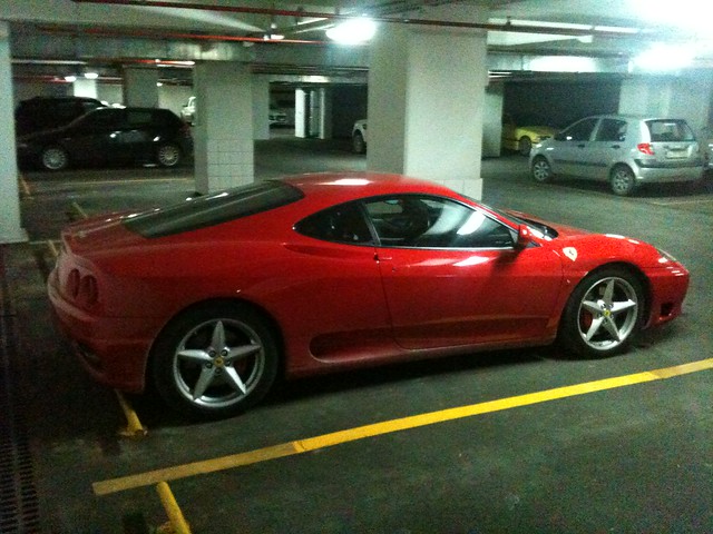 Red Ferrari 360 Modena Parked in the underground private residence of Polat