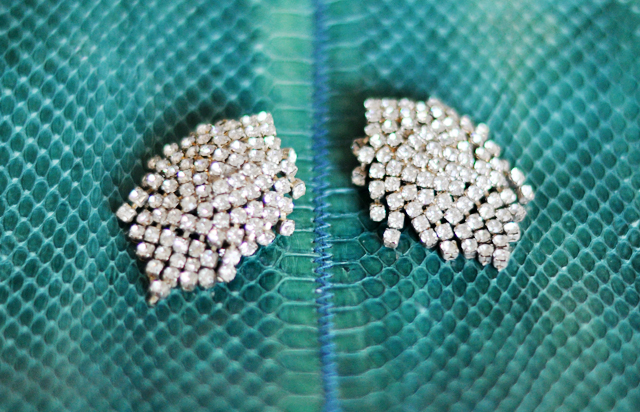 vintage  rhinestone  earrings on   teal snakeskin bag