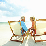 Couple enjoying their golden years on the beach Rimondi Grand Resort and Spa