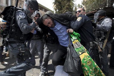 Israeli police officers detain a Palestinian man outside Damascus Gate in Jerusalem's Old City, Friday, March 30. by Pan-African News Wire File Photos