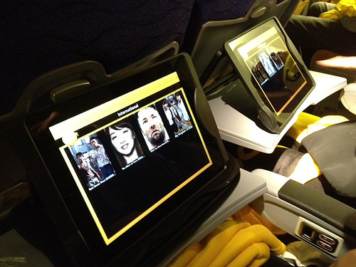 Tablets (iPads) loaded with movies, TV shows and games offer entertainment on the long flight