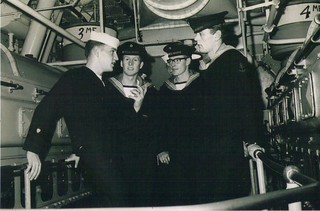 Deceased Petty Officer 2nd class Mark Lowry (left) shares a sea story aboard Coast Guard Cutter Northwind sometime during 1964-65.  Lowry went on to become a Coast Guard surfman at Station Grays Harbor, Wash., where he operated motor lifeboats in breaking surf until 1968.  Photo courtesy of Master Chief Petty Officer Scott Lowry, photographer unknown