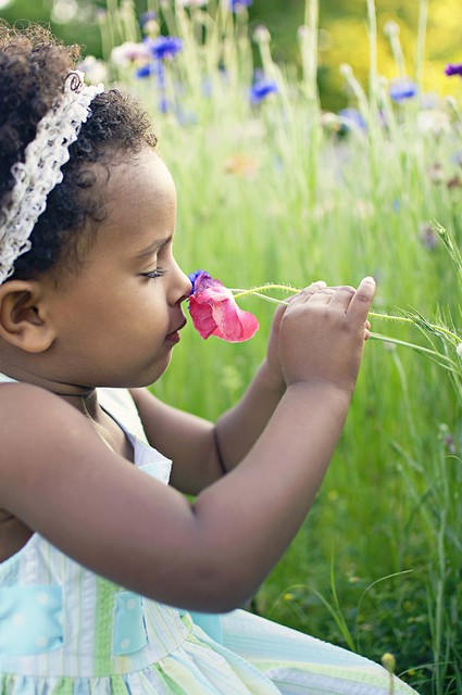 smelling flowers