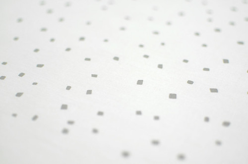 confetti in pale grey on white quilting cotton