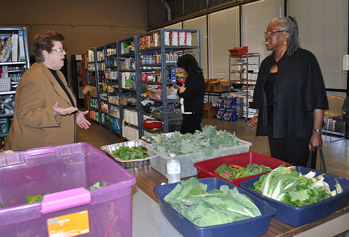 Camilla Zimbal, social services director for Metrocrest Social Services, explains how they get fresh produce for their clients to Audrey Rowe, administrator for Food and Nutrition Service.