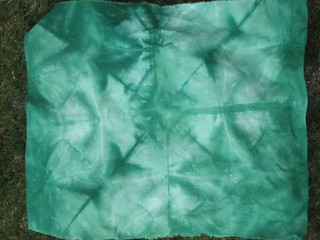 hand dyed by folding fabric in triangles