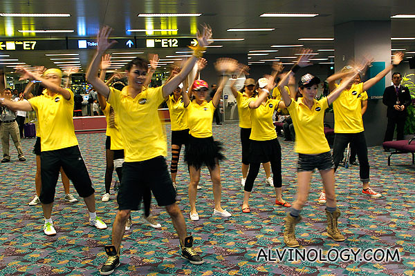 Scoot cabin crew dancing at Changi Airport, just hours before the inaugural flight last year