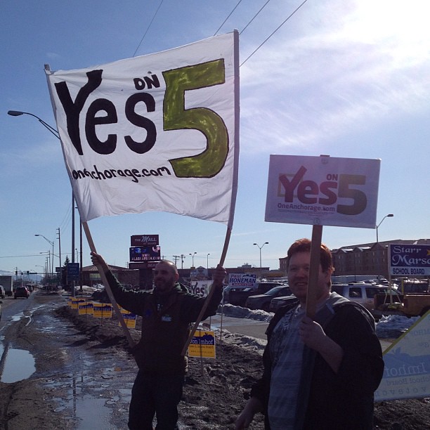 A beautiful day for sign waving: One Anchorage @ N Lts & Seward Hwy. #prop5