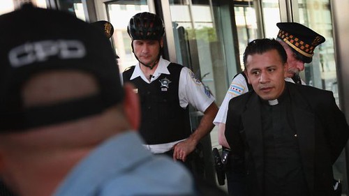 Father Jose Landaverde along with three others were arrested by Chicago police for blocking entrance to an immigration court. The protesters are demonstrating in the lead up to the NATO Summit scheduled to begin on May 20. by Pan-African News Wire File Photos